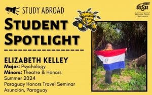 There is a photo of Elizabeth Kelley in Paraguay with a Paraguayan flag wrapped around her back and she is standing in front of many eucalyptus trees. There is also information about Elizabeth Kelley. Her major is Psychology and her minors are Honors and Theatre. She studied abroad summer 2024 in Asuncion Paraguay with the Paraguay Honors Travel Seminar