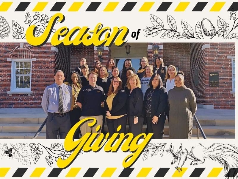 Office of Financial Aid & Scholarships staff smiling on steps. Text: Season of Giving.