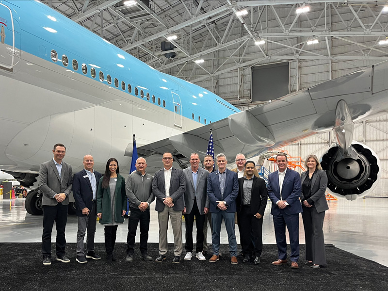 Wichita, Wichita State, SNC and other representatives stand in front of one of the "Nightwatch" aircraft.