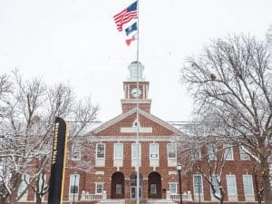 Morrison Hall on campus covered in snow.