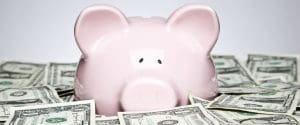 A piggy bank surrounded by month