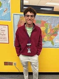 Liam O'Conner poses for a photo in his student teaching classroom.