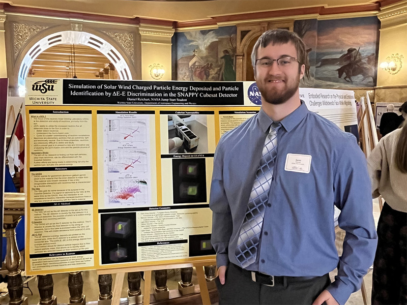 Wichita State senior Daniel Reichart presents his research at the Kansas Capitol building in Topeka for Undergraduate Research Day.