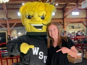 Lindsey Mendenhall poses with WuShock at an event
