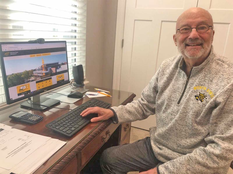 Arland Wallace works at his computer