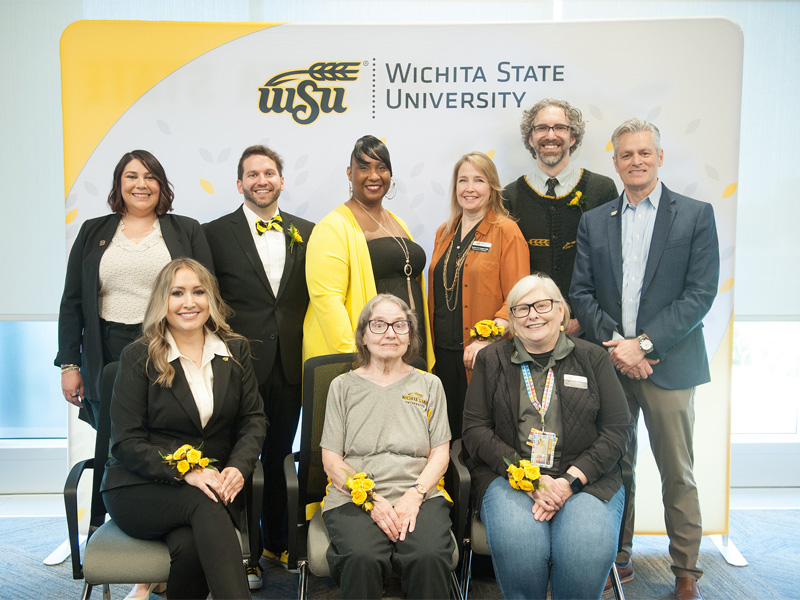 President Rick Muma is with the honorees for the 2025 President's Distinguished Service Awards