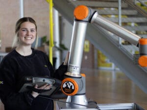 Haylee Thurman works with the robots in the NIAR Automation Research Center.