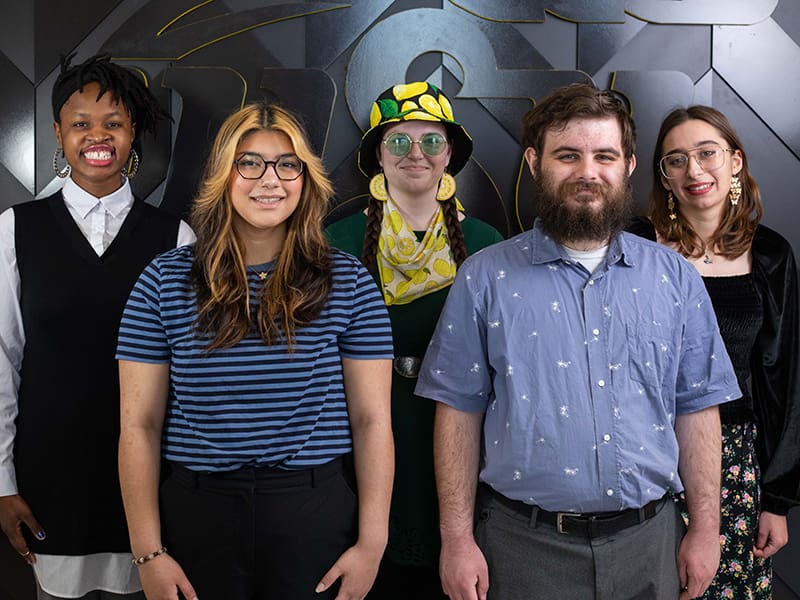 Tutor (316) content creators pose for a photo in the Wichita State Marcus Welcome Center. From left to right, Nyai Jackson, Kelsey Hernandez, Carolyn Henderson, Ian Cook, Kendah Ballout.