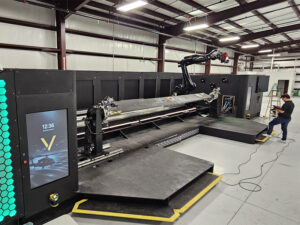 A person works on the new VISION repair robot