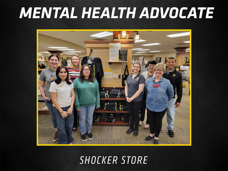 Members of the Shocker Store staff pose near a section of the store that displays Suspenders4Hope merch. Text saying "Mental Health Advocate" and "Shocker Store" line the top and bottom borders.