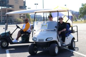 People who have volunteered to be golf cart drivers.