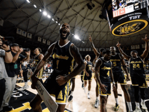 The Aftershocks celebrate in Charles Koch Arena after winning the Wichita regional