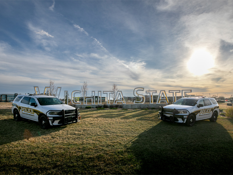 University Police Department cars situated at the Wichita State sign on 21st and Oliver