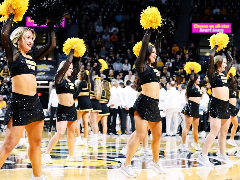 The Shocker dance team perform at a men's basketball game in Charles Koch Arena.