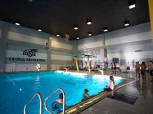 Students using the indoor swimming pool inside the Heskett Center
