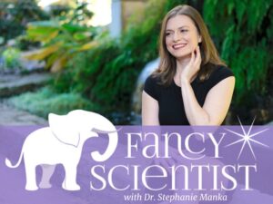 Photograph of Dr. Stephanie Manka sitting on a short wall and smiling with her hand posed on her neck. She is looking away from the camera. Below her is a semi-transparent, purple banner that says "Fancy Scientist with Dr. Stephanie Manka" and includes a white-outline graphic of an elephant next to the text.