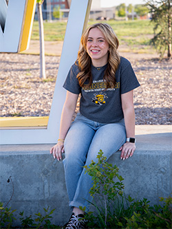 Karaline Scott wearing a grey College of Engineering Wichita State University shirt.