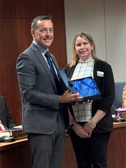 Erin O'Bryan accepts her award at the KBOR meeting Sept. 17.