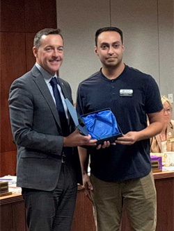 Marco Hernandez accepts his award at the KBOR meeting Sept. 17.