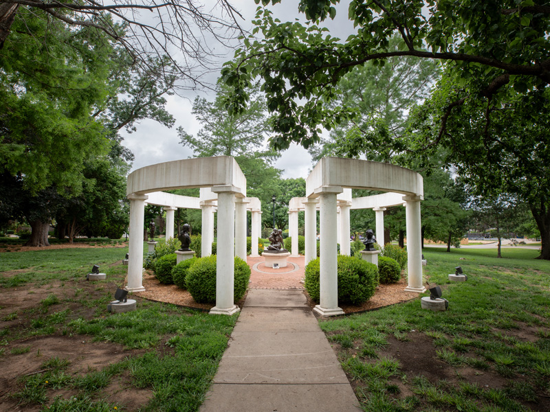The Grafly Gardens on campus, featuring pale pillars surrounding a variety of sculptures on the inside.