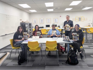 English Career Seminar Class Holding Their Career Ready Guide Textbook