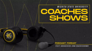 A headset with the WuShock logo on it sits in front of the flying W with the text Wichita State University Coaches Shows