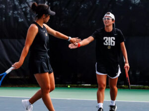 Xin Tong Wang and Giorgia Roselli cheer after scoring a point