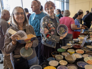 Attendees at Empty Bowls Wichita choose a ceramic bowl to keep.