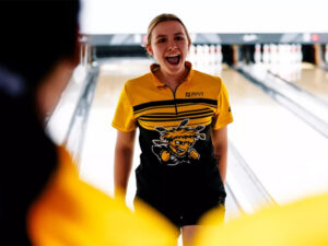 Morgan Kline cheers with her team after hitting a strike