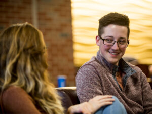 Two students relax in the Rhatigan Student Center between classes