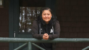 A smiling woman, artist Anna Tsouhlarakis