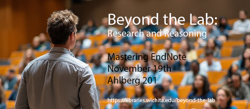 Image of professor interacting with students in an auditorium