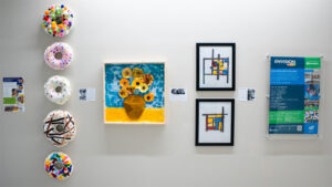 Three talented children from the Cathy G. Hudson Envision Early Childhood Development Center (ECDC) art showcased on the third floor of the Barton School.