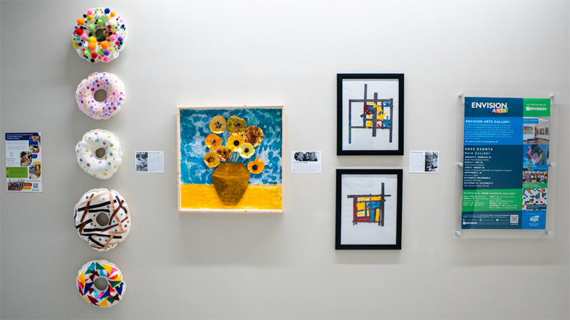 Three talented children from the Cathy G. Hudson Envision Early Childhood Development Center (ECDC) art showcased on the third floor of the Barton School.