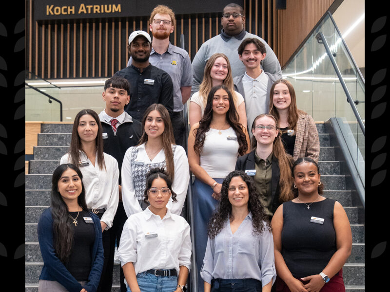 Group of students participating in IMPACT on the social stairs in Woolsey Hall.