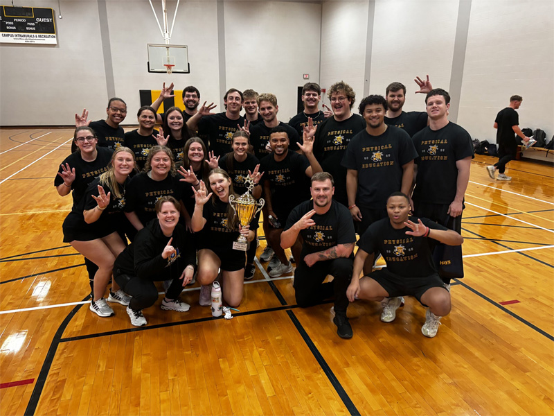 The CAS Physical Education team with their College Bowl trophy.