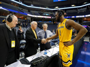 Mike Kennedy handshakes a Shocker player after a game