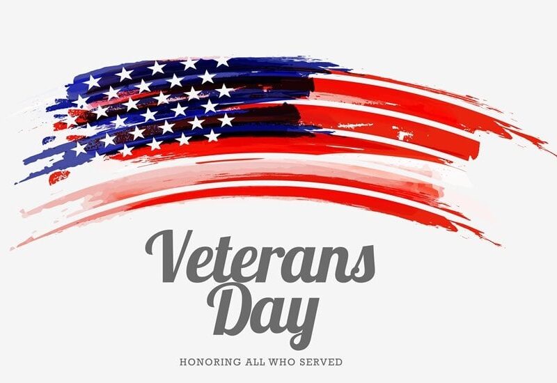 Flag with the words Veterans Day Honoring all who served