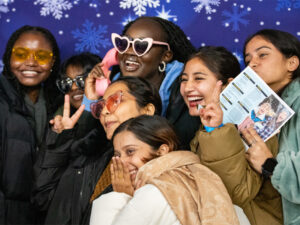 Students gather together to take a selfie at an event