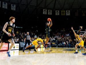 Kenyon Giles shoots 3 pointer
