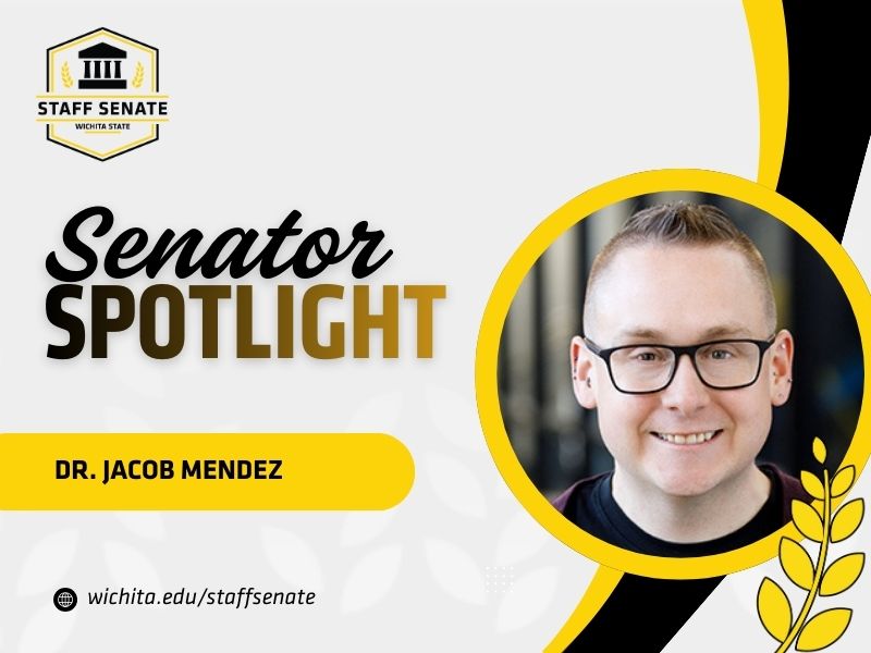 Staff Senate Wichita State Logo on top left corner. Senator Spotlight in bolded text in the middle, with Dr. Jacob Mendez underneath it. A link to wichita.edu/staffsenate at the bottom left corner. Dr. Jacob Mendez photo in the middle right of the page with black and yellow graphic wheat designs.