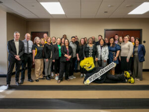 President Rick Muma and WuShock pose with members of the SSP Coalition for Rick Rewards.