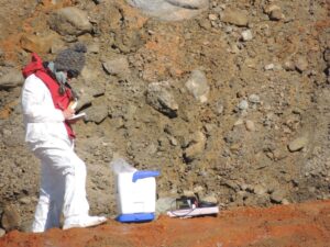Photograph of Dr. Mikucki taking samples in the field.
