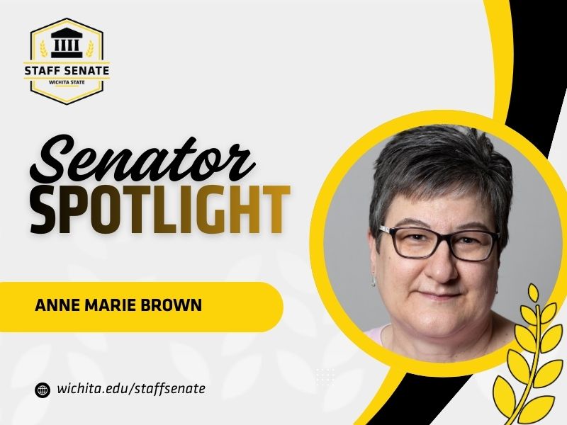 Staff Senate Wichita State Logo on top left corner. Senator Spotlight in bolded text in the middle, with Anne Marie Brown written underneath it. A link to wichita.edu/staffsenate at the bottom left corner. Photo of the senator in the middle right of the page with black and yellow graphic wheat designs.