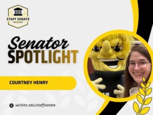 Staff Senate Wichita State Logo on top left corner. Senator Spotlight in bolded text in the middle, with Courtney Henry written underneath it. A link to wichita.edu/staffsenate at the bottom left corner. Photo of the senator in the middle right of the page with black and yellow graphic wheat designs.