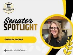 Staff Senate Wichita State Logo on top left corner. Senator Spotlight in bolded text in the middle, with Kennedy Rogers written underneath it. A link to wichita.edu/staffsenate at the bottom left corner. Photo of the senator in the middle right of the page with black and yellow graphic wheat designs.