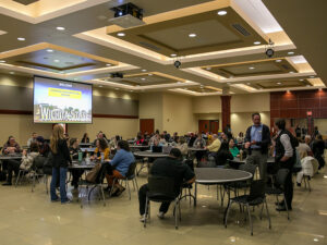 Faculty and staff attend the Strategic Communications Seminar in Beggs Ballroom