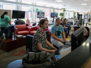 Students play a variety of video games in the Rhatigan Student Center