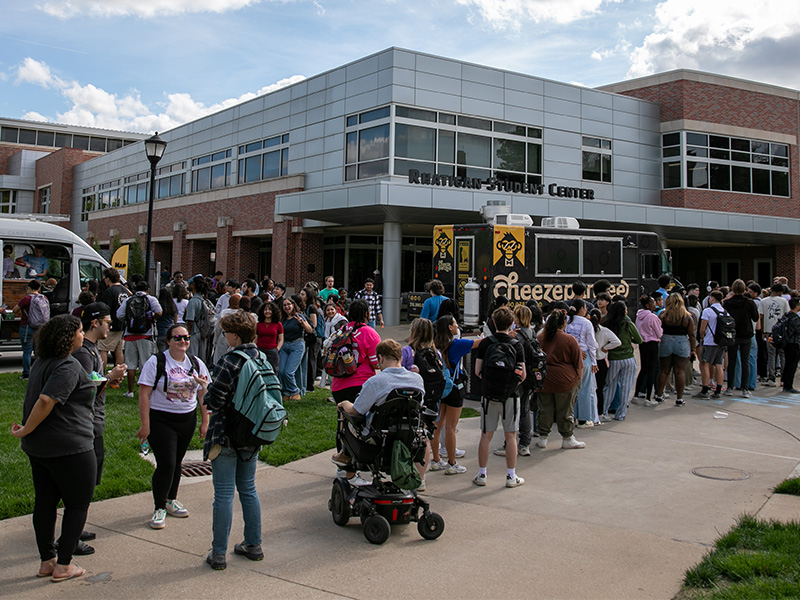 Students gather outside the Rhatigan Student Center for a food truck event
