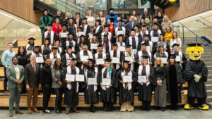 Group photo from Spero graduation with attendees on the social stairs..